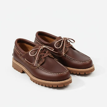 Handcrafted brown leather boat shoes for men — full-grain leather and classic moc-toe stitching.