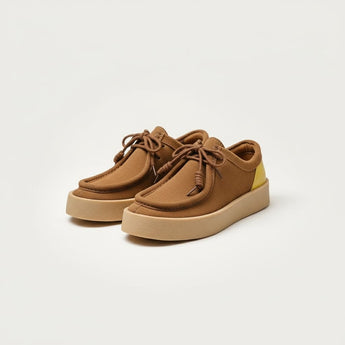 Vintage Patchwork Suede Casual Shoes — brown suede moc-toe sneakers with yellow heel patch and lightweight sole.