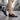 Man walking in comfortable brown leather loafers paired with chinos.