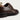Close-up detail showing the rich polished brown leather of the derby shoe.