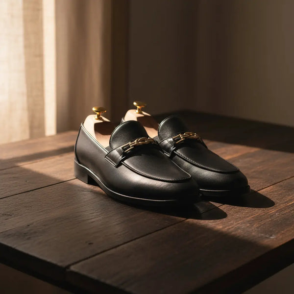 Close-up of Legacy black leather loafers – full-grain leather texture, handcrafted black horsebit loafers