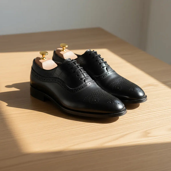 Handcrafted Marquis Oxford Black on wooden table – premium black leather Oxford shoes for men.