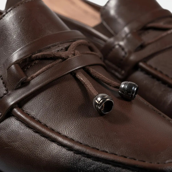 Close-up of Oasis brown full-grain leather loafers — rich grain texture and hand-polished finish.