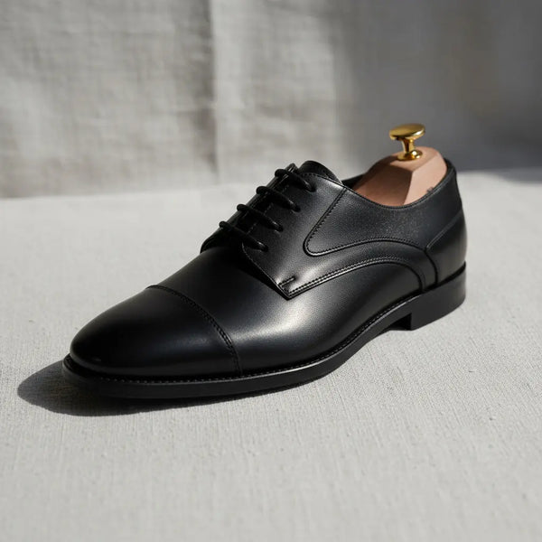 Regal Derby black dress shoes with polished finish—refined derby designed for dinners and evening events.
