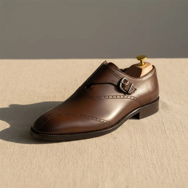 Brown monk strap shoe photographed in natural sunlight — handcrafted dress monk strap with rich patina.