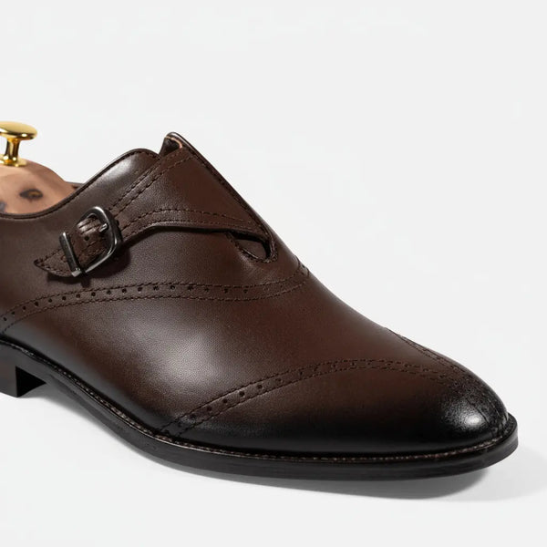 Studio close-up of brown single monk strap shoe — handcrafted leather with Goodyear welt.
