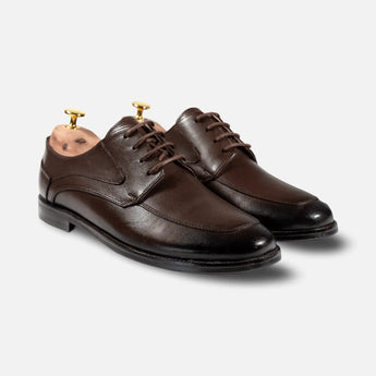 Summit Derby – handcrafted brown leather derby shoes for men on a light grey background, premium dress derby shoes for business and formal wear.
