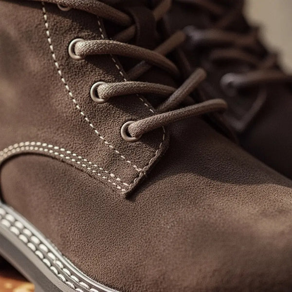 close-up of stitching on men’s suede boots showing Goodyear welt detail