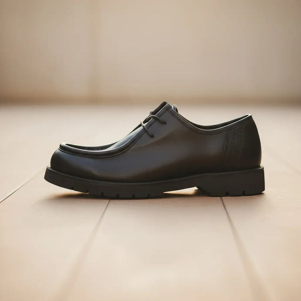 Night-out polish — refined black leather derby shoes for dinners and events.