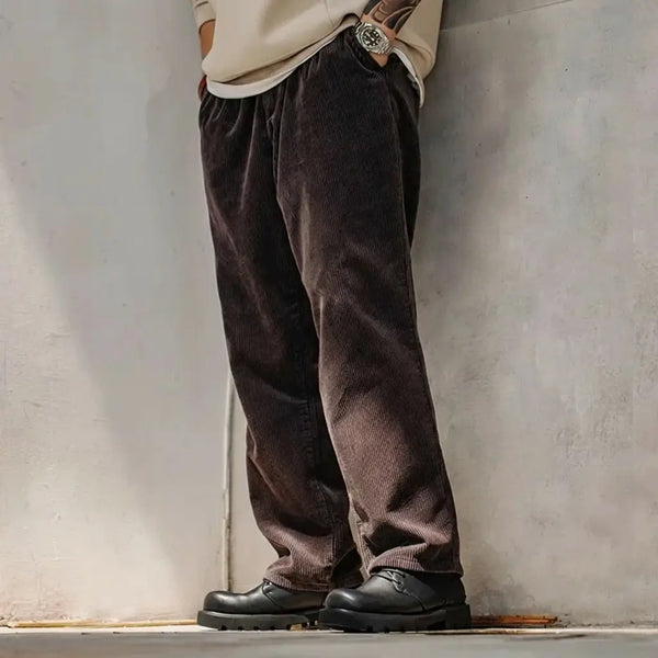 Modern smart-casual outfit with Urban Command black derby shoes — beige sweatshirt and corduroy pants.