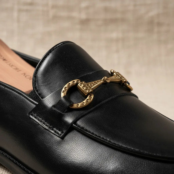 Macro detail of Vanguard Black bit loafers — handcrafted stitching and polished leather strap.