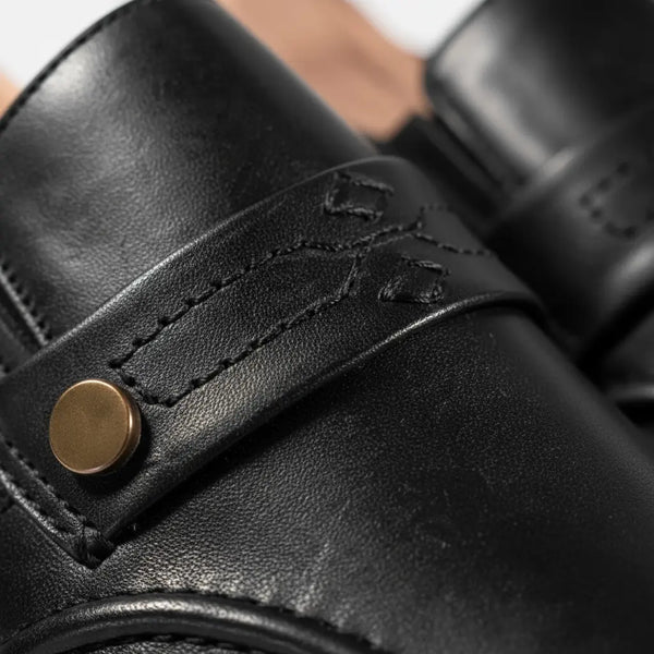 Goodyear welt detail on black penny loafers — durable handcrafted leather loafers for men.