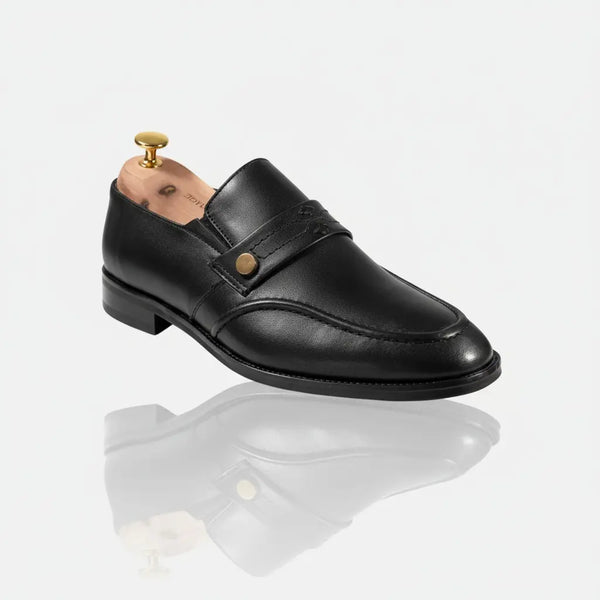 Studio image of Zenith black leather penny loafers — comfortable, handcrafted dress shoes for men.