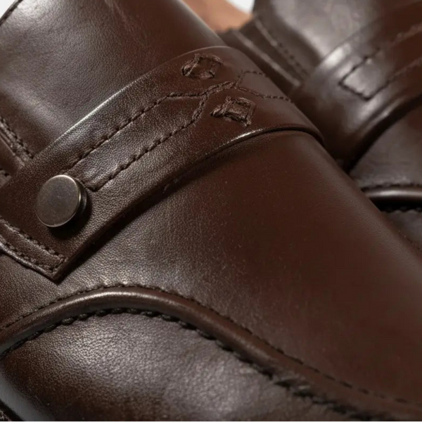 Macro detail of Zenith brown leather loafers showing stitching and Goodyear welt design.
